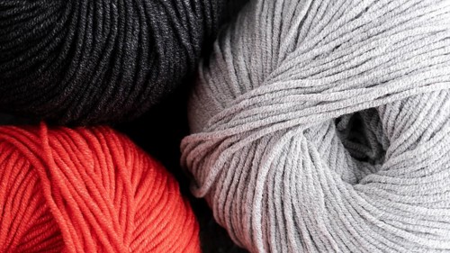 Red black white wool yarn