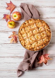 Top view apple pie thanksgiving with autumn leaves