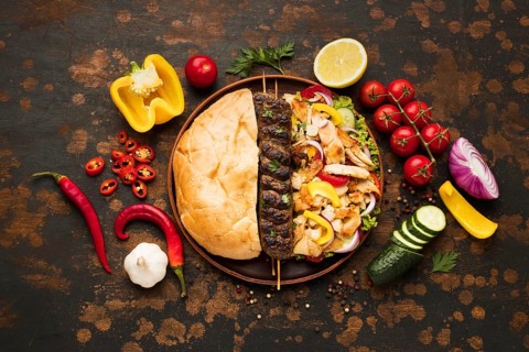 Top view assortment delicious kebabs with vegetables