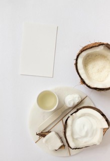 Top view cosmetic with coconut blank card white surface