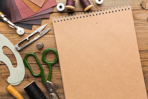 Top view notebook with scissors leather