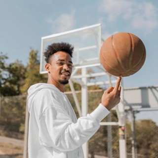 Young man doing tricks with basketball