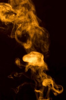 Abstract yellow transparent smoke fumes black background