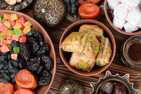Arabian sweets ramadan baklava lukum dried fruits bowl desk