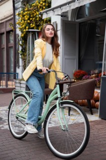 Beautiful woman with her bike street