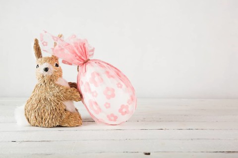 Big egg near toy bunny