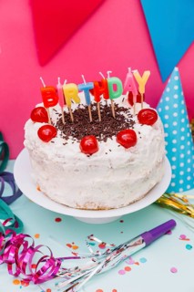 Birthday candles white cake with party decoration