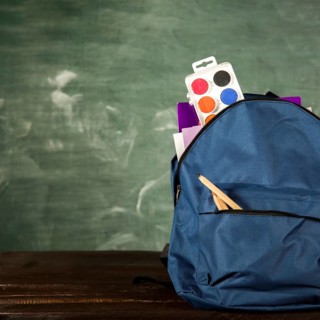 Blue backpack with stationery watercolors