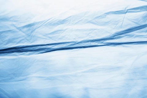 Blue plastic bag texture close up