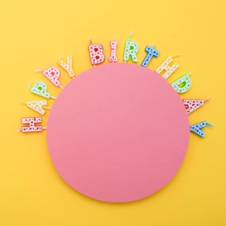 Circle unlit birthday candles with letters