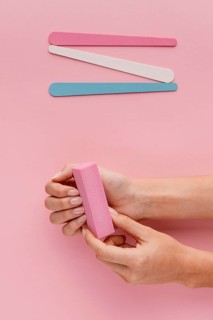 Close up hand filing nails