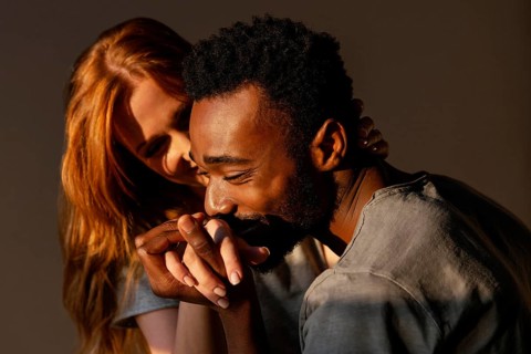 Close up man kissing woman s hand