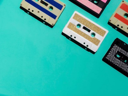 Colorful cassette tapes corner with copy space