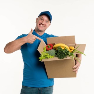 Delivery man pointing grocery box