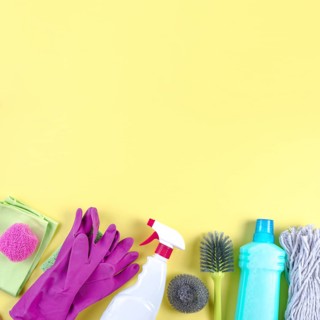 Different cleaning equipments yellow backdrop