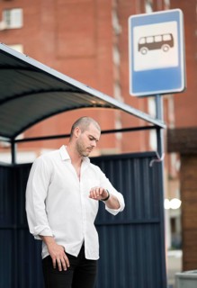 Elegant adult male waiting bus