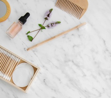 Flat lay cosmetic products frame with copy space