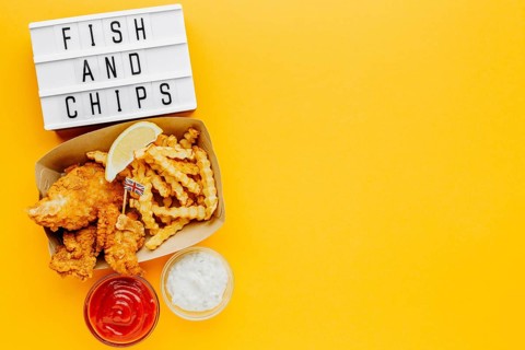 Flat lay fish chips with sauce light box