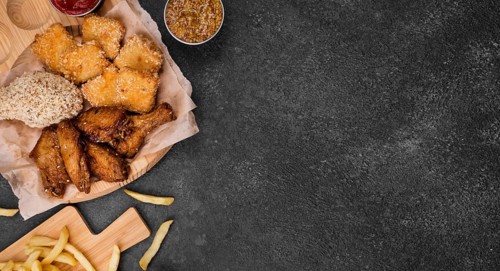 Flat lay fried chicken with french fries copy space