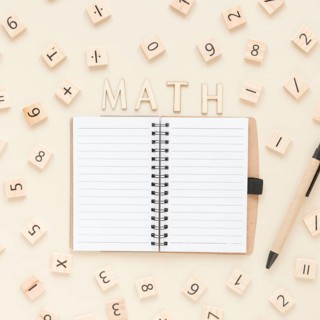 Flat lay math science scrabble board numbers with notebook