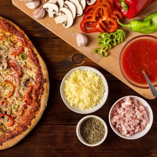 Flat lay pizza with pepper ingredients