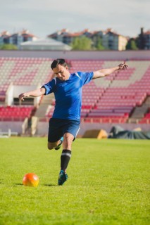 Football player shooting kick