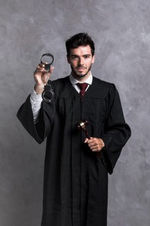Front view judge robe with handcuffs gavel