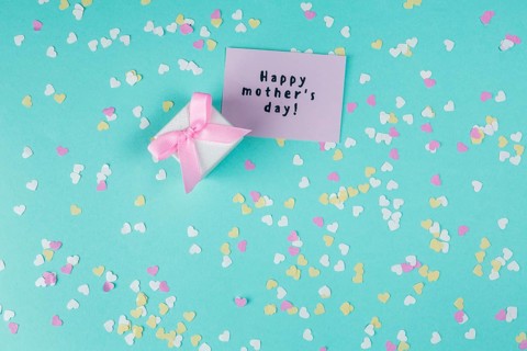 Happy mothers day inscription with small gift box