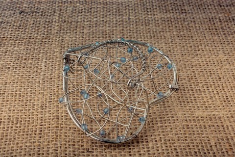 Heart shaped placed cage on linen canvas