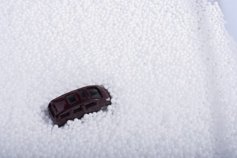 Model car on little white polystyrene foam balls