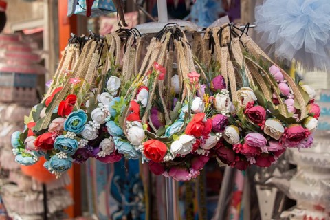 Colorful crowns for sale made of fake flowers