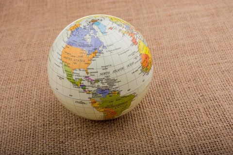 Globe placed on a brown fabric background