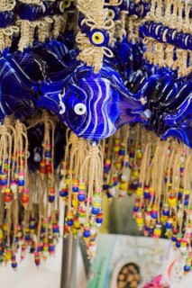 Evil eye bead as Amulet souvenir in the shape of fish from Turkey