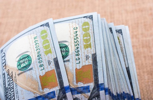 Banknotes of US dollars on canvas on a linen canvas