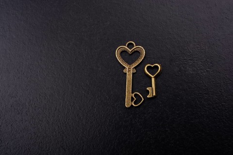 Heart shaped retro metal keys on dark background