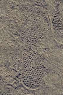 Footstep on sand stones textured as abstract grunge background