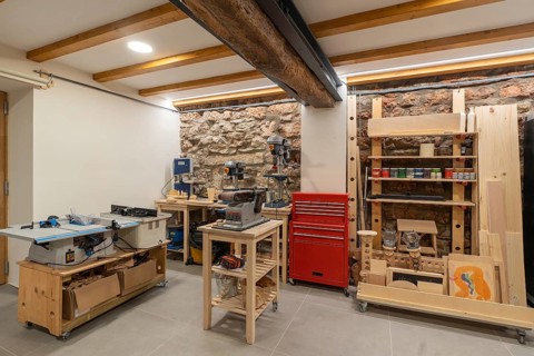 Interior space of a printing press studio with no people equipped with tools and furniture