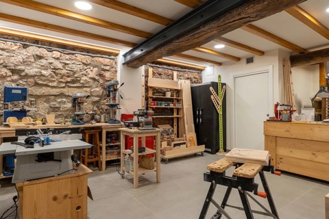 Interior space of a screen printing studio with no people and different tools and furniture to work