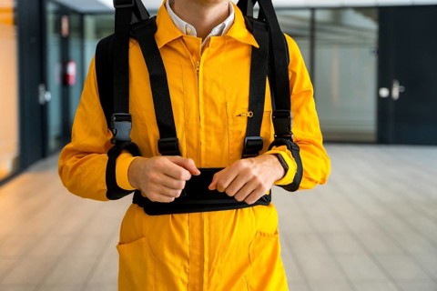 Portrait of an unrecognizable employee with an exoskeleton from a futuristic high-tech warehouse
