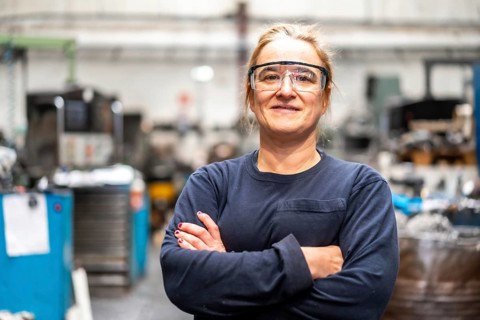 Portrait of factory worker operator working in numerical control sector