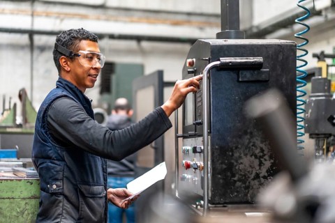 Latin worker operator of the metal industrial factory trade of the numerical control sector