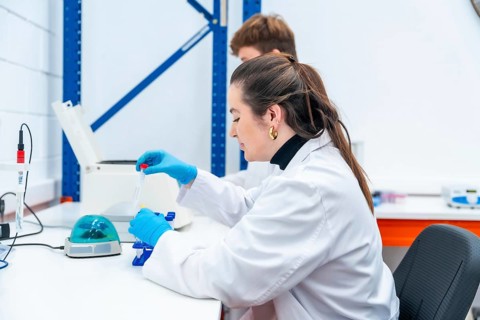 Young scientists working with samples sitting on a research laboratory