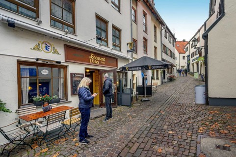 Narrow alley with Irish Pub