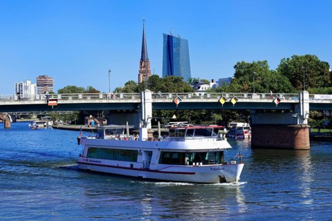Tourist boat cruising in front of European Central Bank Building in the banking district