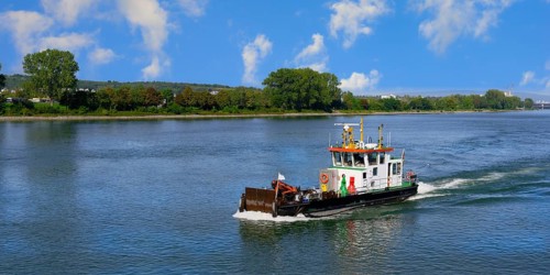 Inspection ship navigating on the Rhine River near Mainz