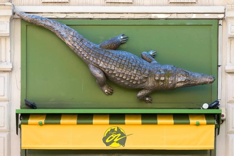 Crocodile figure above Cafe Oz