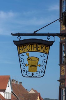 Historic nose plate with a mortar at a pharmacy