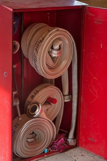 Cabinet with fire hoses from the volunteer fire brigade in a bus stop