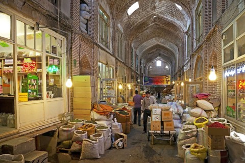 Large bags with spices for sale in the old historic bazaar of the city Tabriz