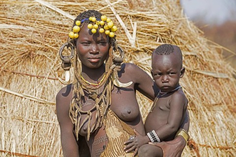 Black woman with child of the Mursi